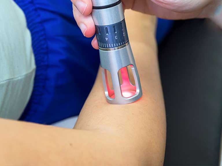 Patient receiving Class III Laser Therapy at Vitality Integrative Wellness in Temecula for joint pain relief